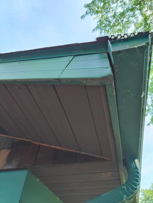 overhang with repaired wood and stained